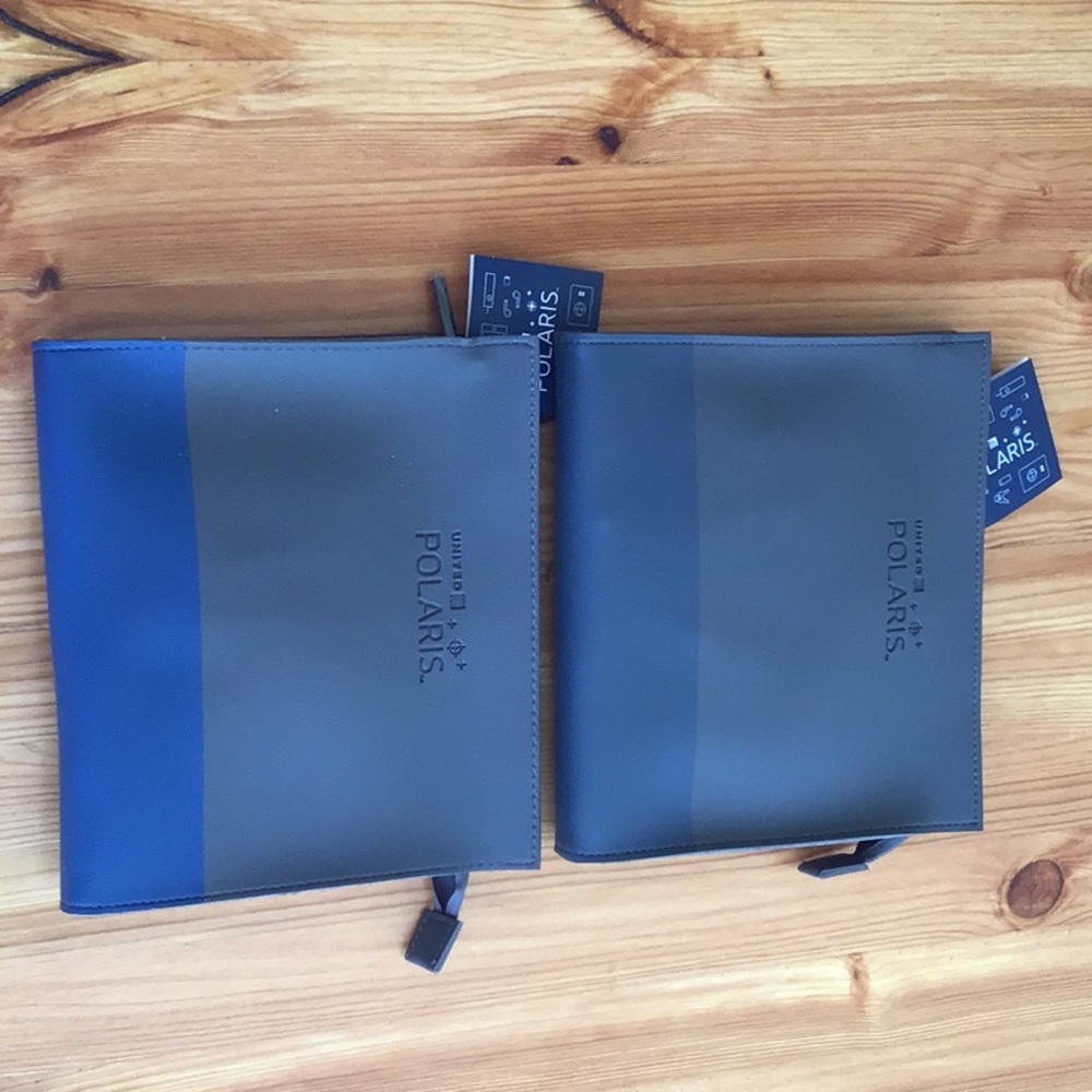 Two United airline business class Polaris toiletry bags